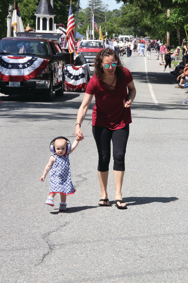 TOO YOUNG TO MARCH: Rachel Labutti had to retrieve her daughter, Emma, who was anxious to join the marchers.